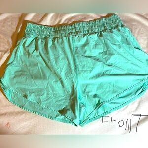 Blue Athletic Shorts with Elastic Waistband and Curved Hems